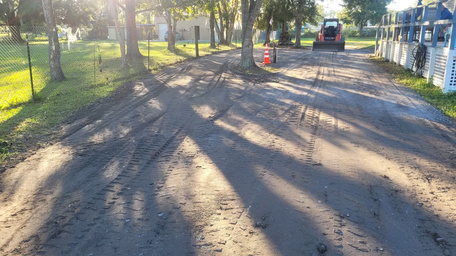 Long driveway graded under oak trees in Osceola County